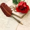 Picture of hand-written letters, a quill pen, and a red rose