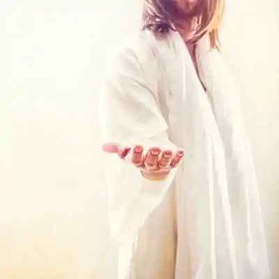 Image of Jesus extending His hand to us